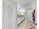 Bathroom view showcasing vanity with double sinks and a shower with decorative curtain at 12841 Wildflower Meadow Dr, Riverview, FL 33579