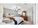 Bright bedroom with a ceiling fan, dresser, and a large window offering plenty of natural light at 12841 Wildflower Meadow Dr, Riverview, FL 33579