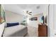 The bedroom features a bed, desk, and TV, providing a comfortable and functional living space at 12841 Wildflower Meadow Dr, Riverview, FL 33579