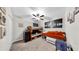 This bedroom features a bunk bed, twin bed, accent painting, carpet and ceiling fan at 12841 Wildflower Meadow Dr, Riverview, FL 33579