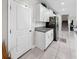The kitchen includes granite counters, stainless appliances, and white cabinetry for a modern look at 12841 Wildflower Meadow Dr, Riverview, FL 33579