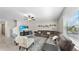 Inviting living room with plush sectional sofa, ceiling fan, and lots of natural light from the window at 12841 Wildflower Meadow Dr, Riverview, FL 33579