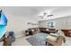 Spacious living room with neutral walls, comfortable seating, and large windows for natural light at 12841 Wildflower Meadow Dr, Riverview, FL 33579