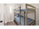 Comfortable bedroom with a sturdy bunk bed frame, perfect for or guests at 13501 Whitby Rd, Hudson, FL 34667