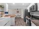 Modern kitchen with white cabinets, stainless steel appliances, and butcher block countertops at 13501 Whitby Rd, Hudson, FL 34667