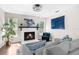 Cozy living room with a fireplace and comfortable seating arrangement at 13501 Whitby Rd, Hudson, FL 34667