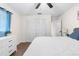 Spacious main bedroom with a large closet, ceiling fan, and modern decor at 13501 Whitby Rd, Hudson, FL 34667