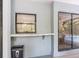Covered patio with built-in counter and view of the screened-in pool area through sliding glass doors at 13501 Whitby Rd, Hudson, FL 34667