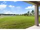 Expansive backyard overlooking a tranquil pond, perfect for outdoor enjoyment at 14403 Woodland Spur Dr, Lithia, FL 33547