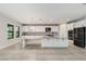 Modern kitchen featuring white cabinets, granite countertops, and stainless steel appliances at 14403 Woodland Spur Dr, Lithia, FL 33547