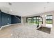 Open-concept kitchen with granite countertops, stainless steel appliances, and abundant natural light at 14403 Woodland Spur Dr, Lithia, FL 33547