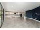 Open-concept living area featuring tile floors, kitchen, and abundant natural light at 14403 Woodland Spur Dr, Lithia, FL 33547