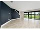 Open living room with sliding glass doors that overlook the lake at 14403 Woodland Spur Dr, Lithia, FL 33547
