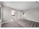 Carpeted Main Bedroom that leads to bathroom at 14403 Woodland Spur Dr, Lithia, FL 33547