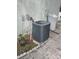 Side view of exterior AC and water softener unit on home at 14633 Sassandra Dr, Odessa, FL 33556