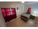 Cozy bedroom with a bed, window, and bedside table under soft lighting at 14633 Sassandra Dr, Odessa, FL 33556
