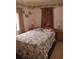 Cozy bedroom with a comfortable bed, wood floors, and soft lighting at 14633 Sassandra Dr, Odessa, FL 33556