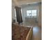 Bright bedroom with a ceiling fan, windows, and decorative objects on a dresser at 14633 Sassandra Dr, Odessa, FL 33556
