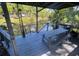 Over-water deck featuring a picnic table, grill, and captivating lake views at 14633 Sassandra Dr, Odessa, FL 33556