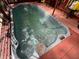 Inviting in-ground hot tub with crystal-clear water, perfect for relaxation and enjoyment at 14633 Sassandra Dr, Odessa, FL 33556