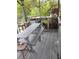 Outdoor patio with picnic table and sink surrounded by woods at 14633 Sassandra Dr, Odessa, FL 33556