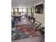 Inviting porch with a seating area, TV, and natural light at 14633 Sassandra Dr, Odessa, FL 33556