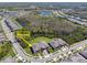 An aerial view shows a residential area, showcasing homes, landscaping, and nearby natural features at 16710 Shell Bay Dr, Land O Lakes, FL 34638