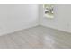 Bedroom featuring neutral tile flooring and natural light from a window at 16710 Shell Bay Dr, Land O Lakes, FL 34638