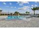 A lagoon style pool surrounded by palm trees offers residents a refreshing escape and a social gathering spot at 16710 Shell Bay Dr, Land O Lakes, FL 34638
