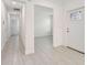 Bright entryway with tiled flooring, white walls, and stained glass front door at 16710 Shell Bay Dr, Land O Lakes, FL 34638