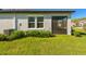 A screened lanai with grass yard at 16710 Shell Bay Dr, Land O Lakes, FL 34638