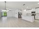 Spacious kitchen and dining area featuring stainless steel appliances and a center island at 16710 Shell Bay Dr, Land O Lakes, FL 34638