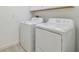 Laundry room with white washer and dryer at 16710 Shell Bay Dr, Land O Lakes, FL 34638