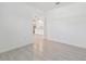 Bright living space featuring tile floors and a view into the modern kitchen at 16710 Shell Bay Dr, Land O Lakes, FL 34638