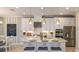 Beautiful kitchen with a center island, stainless steel appliances, pendant lights, and sleek cabinets at 1714 Trailhead Ln, Zephyrhills, FL 33541