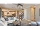 Bright living room that flows into the kitchen, with comfortable seating and stylish decor at 1714 Trailhead Ln, Zephyrhills, FL 33541
