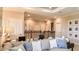 Upstairs loft featuring comfortable sofa with accent pillows and desk space at 1714 Trailhead Ln, Zephyrhills, FL 33541