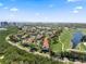Aerial view of townhomes near a golf course, showcasing a serene and inviting neighborhood at 1901 Oyster Catcher Ln # 823, Clearwater, FL 33762