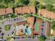 Overhead shot of the community's amenities including a pool, spa, and tennis court at 1901 Oyster Catcher Ln # 823, Clearwater, FL 33762