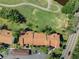An aerial shot showing the condo building surrounded by landscaping and roadways at 1901 Oyster Catcher Ln # 823, Clearwater, FL 33762