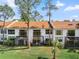 Beautiful backyard of condo buildings, complete with screened patios and landscaping at 1901 Oyster Catcher Ln # 823, Clearwater, FL 33762