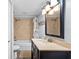 Bathroom featuring a vanity with great storage and a shower-tub combo at 1901 Oyster Catcher Ln # 823, Clearwater, FL 33762