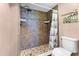 Bathroom with fully tiled shower, rainfall showerhead, and nautical-themed decor for a relaxing feel at 1901 Oyster Catcher Ln # 823, Clearwater, FL 33762