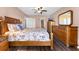 Well-appointed bedroom featuring a full ensuite bathroom, a walk-in closet, and tasteful nautical decor at 1901 Oyster Catcher Ln # 823, Clearwater, FL 33762