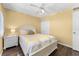 Cozy bedroom featuring a comfy queen bed, a ceiling fan, and closet space at 1901 Oyster Catcher Ln # 823, Clearwater, FL 33762