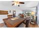 Dining room showcasing a wood table set with seating for four and view into the living area at 1901 Oyster Catcher Ln # 823, Clearwater, FL 33762