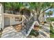 Exterior shot of condo buildings with well-maintained landscaping and stairs at 1901 Oyster Catcher Ln # 823, Clearwater, FL 33762
