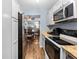 Bright kitchen features stainless steel appliances, granite countertops, and dining room view at 1901 Oyster Catcher Ln # 823, Clearwater, FL 33762