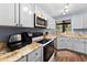 Beautifully appointed kitchen featuring stainless steel appliances, granite countertops, and neutral cabinets at 1901 Oyster Catcher Ln # 823, Clearwater, FL 33762