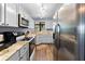 Bright kitchen features stainless steel appliances, granite countertops, and ample storage space at 1901 Oyster Catcher Ln # 823, Clearwater, FL 33762